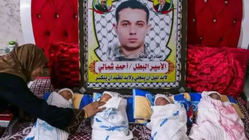 Imprisoned Palestinian terrorist Ahmad Shamali with his four children, who were reportedly conceived with sperm smuggled out of Israel’s Nafha Prison to the Gaza Strip. Source: Screenshot.