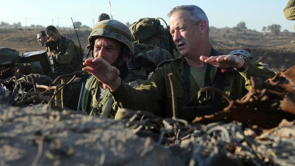 Israel Defense Forces Chief of Staff Lt. Gen. Benny Gantz (right) in action during a live-fire exercise for Israeli army battalion commanders taking place in the Golan Heights on Sept. 4, 2012. Syrian tanks entered the Golan Heights demilitarized zone, raising concerns that the ongoing civil war could spill over into Israel. After Syrian tanks entered the Golan's demilitarized zone on Nov. 3, Gantz told IDF soldiers the Syrian civil war "could turn into our affair” in Israel. Credit: Shay Wagner/IDF/Flash90.
