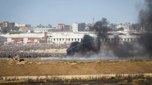 Thousands of Palestinians protest by the border fence, as seen from the Israeli side, on the same day that the new U.S. embassy opened in Jerusalem on May 14, 2018. Photo by Flash90.