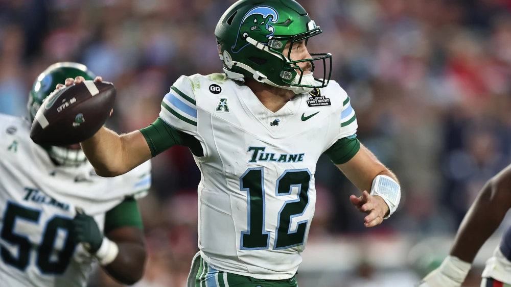 Jake Retzlaff, quarterback of the Tulane Green Wave, makes a pass during the fourth quarter of the 2025 College Football Playoff First Round Game against the Ole Miss Rebels at Vaught-Hemingway Stadium in Oxford, Miss., on Dec. 20, 2025. Credit: Justin Ford/Getty Images.