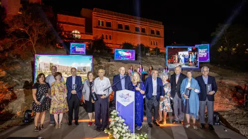 JCT vice president Stuart Hershkowitz poses with major donors at the site of the new Tal Campus for women. Photo by Yechiel Itkin.