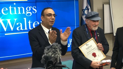 Government Press Office director Nitzan Chen and 95-year-old Walter Bingham, December 2019. Photo by Judy Lash Balint.