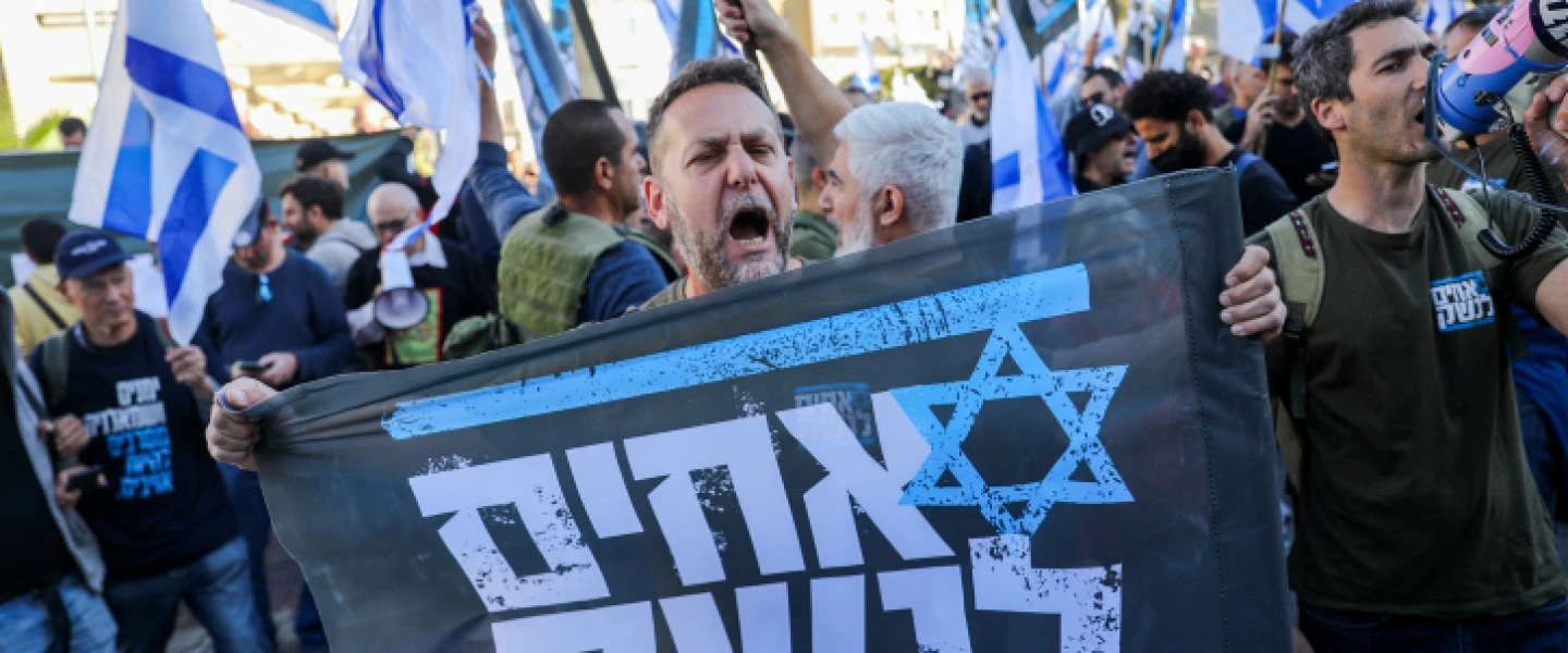 An Israel Defense Forces reservist from the Brothers in Arms protest group attends a demonstration against judicial reform in Bnei Brak, near Tel Aviv, March 16, 2023. Photo by Flash90.