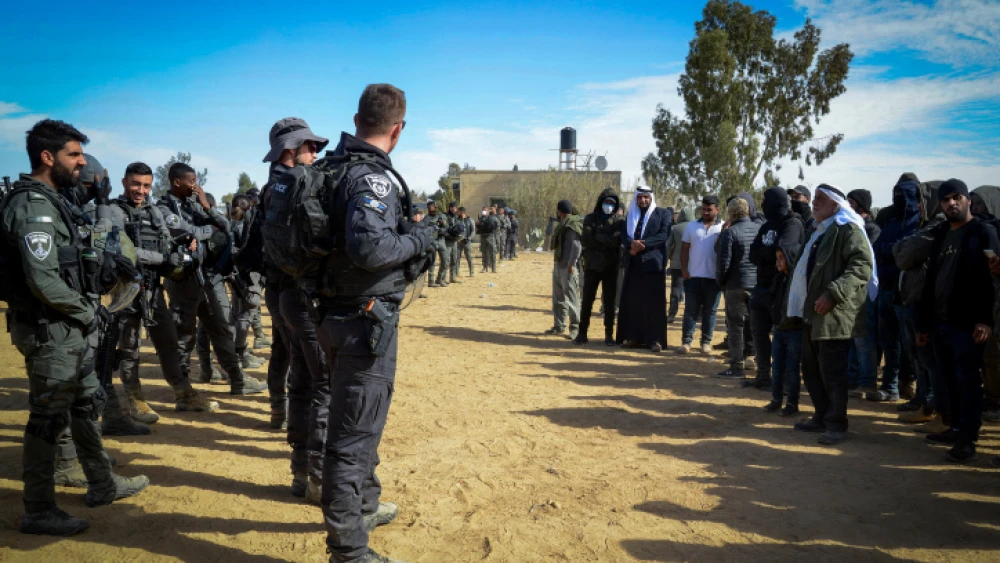 Israeli Police stand guard during a protest against tree-planting by the Jewish National Fund-Keren Kayamet LeIsrael outside the Bedouin village of al-Atrash in the Negev Desert on Jan. 12, 2022. Photo by Flash90.
