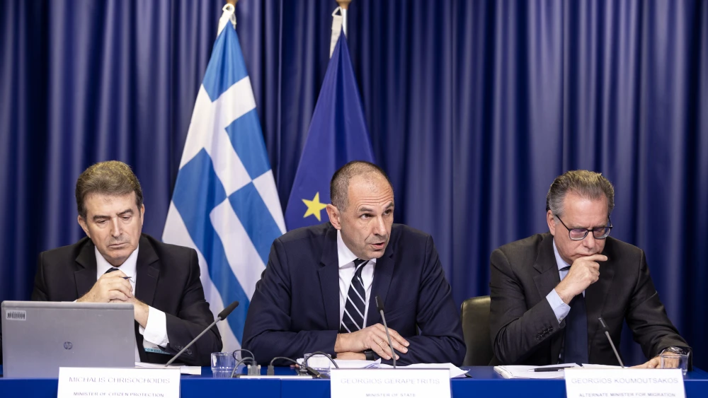 Greek Minister for Citizen Protection Michalis Chrisochoidis, left, and other Greek officials speak to media about the situation at the Greek/Turkish border in Brussels, Belgium on March 4, 2020. Photo by Thierry Monasse/Getty Images.