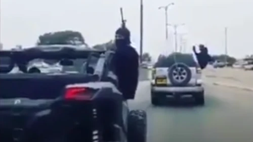 Bedouin wedding celebrants shoot M-16s in the air on an Israeli road. Source: Screenshot.