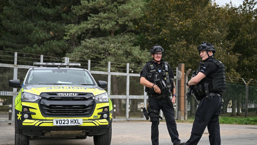 Armed police stand guard manning a roadblock at an entrance to RAF Fairford base in south-west England, Sept. 27, 2026. Photo by Justin Tallis/AFP via Getty Images.