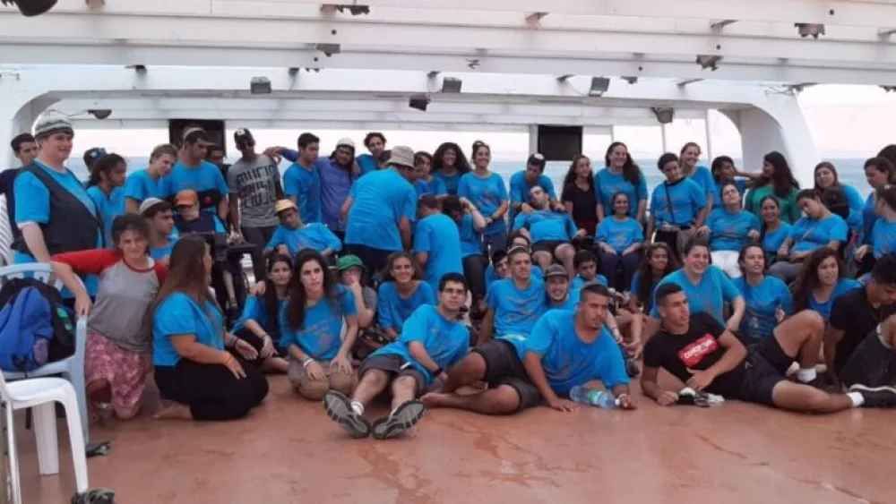 Camp Eitan campers on a boat on the Sea of Galilee. Manager Tova Hadad is on the far left. Photo courtesy of Tova Hadad.