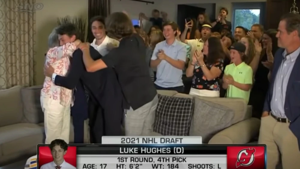 Luke Hughes celebrates with his family after being selected in the first round of the NHL draft. Source: Screenshot.