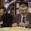Former Israeli Knesset member and leader of the Otzma Yehudit Party Michael Ben-Ari (right) with Baruch Marzel at the party's inaugural election conference in Petach Tikvah, on Dec. 24, 2014. Photo by Tomer Neuberg/Flash90.