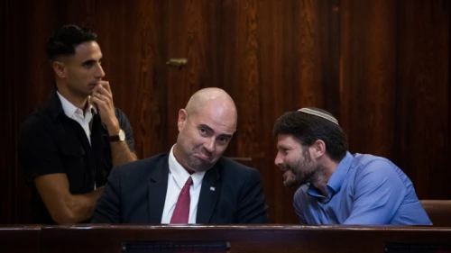 Then-Jewish Home Knesset member Bezalel Smotrich with Likud Knesset member Amir Ohana during a special Plenary Hall session at the Knesset in Jerusalem on Aug. 8, 2018. Photo by Yonatan Sindel/Flash90.