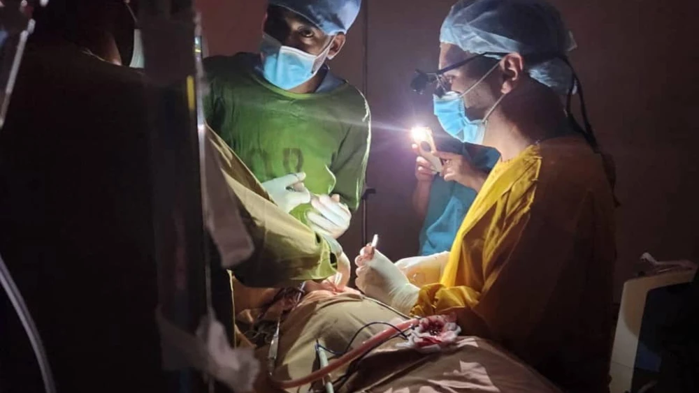 Israeli and Ethiopian doctors operating on a three-year-old child during a power failure at the St. Peter’s Hospital in Addis Ababa, Ethiopia. Photo by Dr. Vasile Recea via TPS.