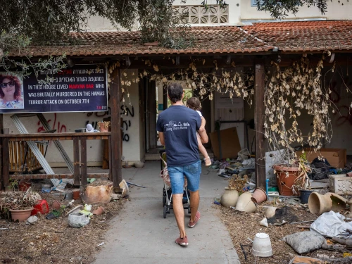 Family members and friends visit Kibbutz Be'eri, a year after the Hamas massacre there, on Oct. 7, 2024. Photo by Yonatan Sindel/Flash90.