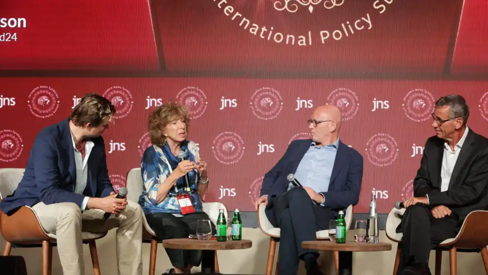 Mark Regev (right), host of the JNS “Israel Undiplomatic” podcast and former Israeli ambassador to the United Kingdom, moderates a panel discussion with Lord David Wolfson, shadow attorney general of the United Kingdom; Fiamma Nirenstein, JNS senior contributing editor and former vice president of the Italian Parliament’s Foreign Affairs Committee; and Stefan Tompson, founder of Visegrád24, at the second annual JNS International Policy Summit at the Waldorf Astoria in Jerusalem, June 23, 2026. Credit: JNS.