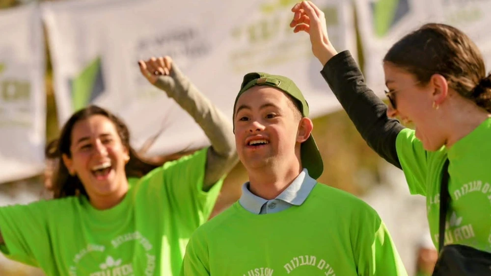 Runners of varied ages, backgrounds and levels of ability reach the finish line together at ADI’s second annual “Race for Inclusion” on Dec. 29, 2022.