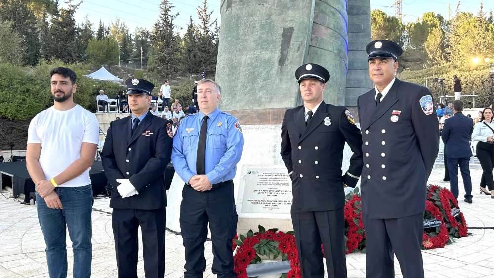 American first responders pose for a photograph at the 9/11 memorial in Jerusalem, September 11, 2025.