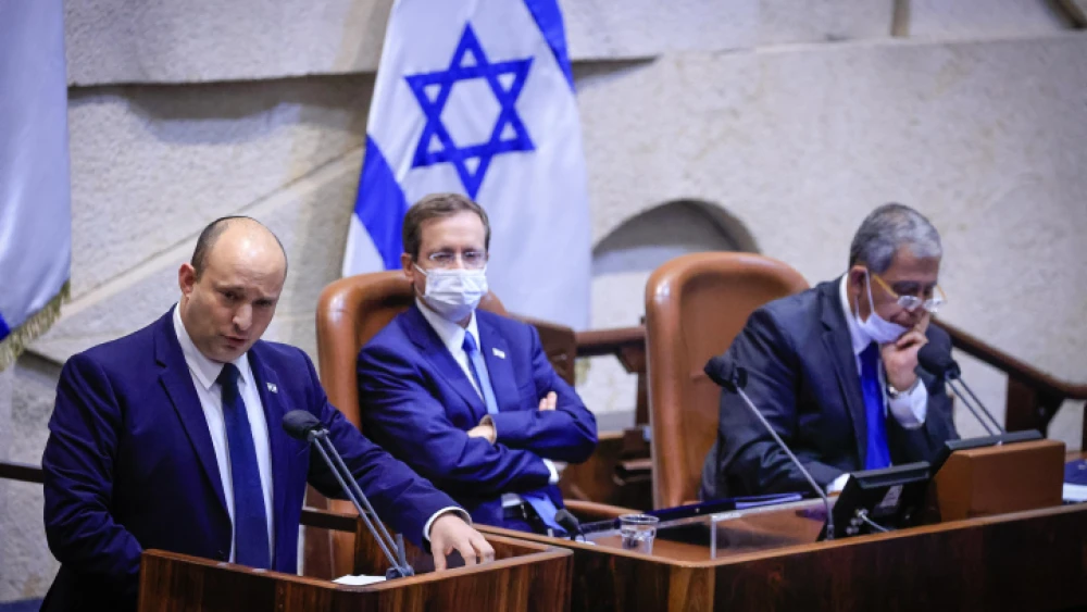 Israeli Prime Minister Naftali Bennett (with President Isaac Herzog and Knesset Speaker Miki Levy next to him) addresses the opening of the Knesset's winter session, Oct. 4, 2021. Photo by Olivier Fitoussi/Flash90.