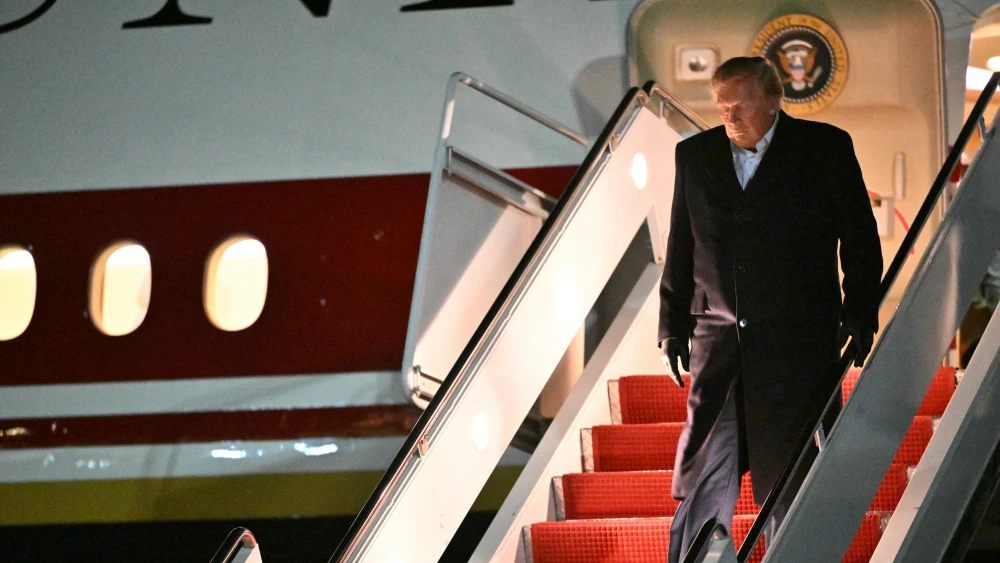 U.S. President Donald Trump steps off Air Force One upon arrival at Joint Base Andrews, Md., in the early hours of Oct. 8, 2026. Photo by Mandel Ngan/AFP via Getty Images.