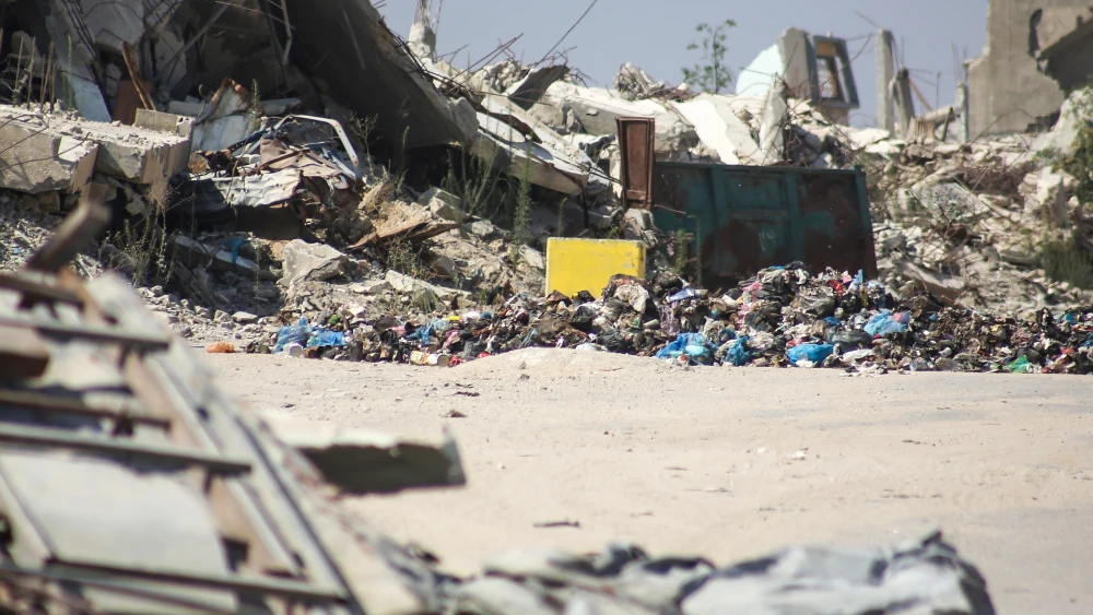 Yellow concrete blocks are seen amongst the rubble on July 16, 2026 in Gaza City, Gaza. Photo by Ahmad Hasaballah/Getty Images.