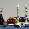 Illustration of a Shabbat table with the customary wine, challah and candles, which will all be blessed before the meal (photo was not taken on Shabbat). Photo by Mendy Hechtman/Flash90.
