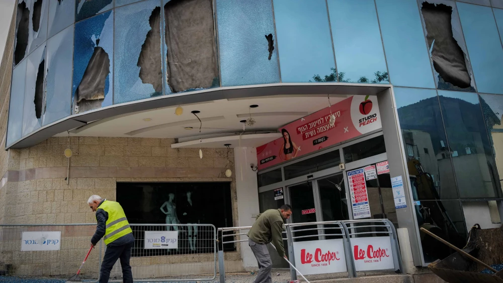 Residents of Kiryat Shmona check last night's missile-attack damage at the city's central bus station and mall on Nov. 27, 2024. Photo by Michael Giladi/Flash90.
