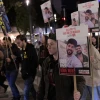 Family, friends and activists hold posters of Israeli brothers Gili and Ziv Berman, who are being held hostage by Hamas terrorists in Gaza, during a protest march for their release in Tel Aviv, Jan. 9, 2025. Photo by Tomer Neuberg/Flash90.