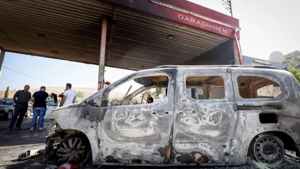 Burned cars in the village of Al-Lubban, next to the Israeli town of Eli. According to Al-Lubban village residents, Israeli Jews attacked the village and burned a gas station and several cars, a day after a terror attack near Eli in which four Israelis were killed. Photo by FLASH90.
