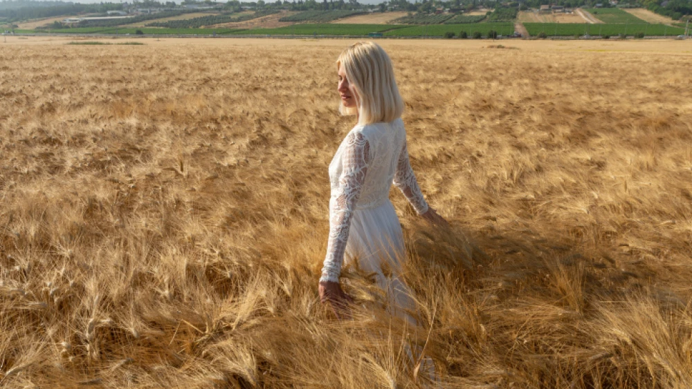 A woman dressed in a white dress as is tradition for Shavuot, May 31, 2019. Photo by Mila Aviv/Flash90.