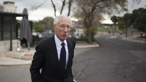 Click photo to download. Caption: Stanley Fischer, the Governor of the Bank of Israel, leaves after a meeting at the Prime Minister's Office in Jerusalem, March 17, 2013. Fischer, who will leave his position in a few months, has stewarded the Israeli economy through an era of stability amid a global crisis. Credit: Yonatan Sindel/Flash90.