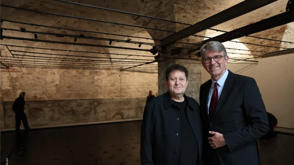 Israeli sculptor Belu-Simion Fainaru (left) with German Culture Minister Wolfram Weimer at the Israeli pavilion of the Venice Biennale art show in Italy on May 15, 2026. Credit: Courtesy of the German Ministry of State for Culture and Media.