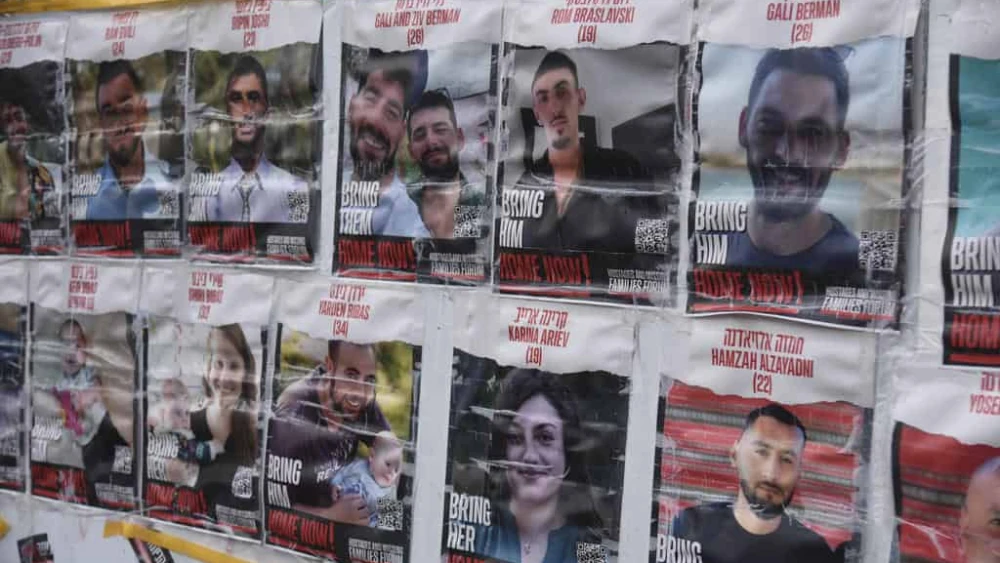 Photos of Israeli hostages held by Hamas in Gaza are seen at a protest camp near the Knesset in Jerusalem, Jan. 14, 2024. Photo by Yoav Dudkevitch/TPS.