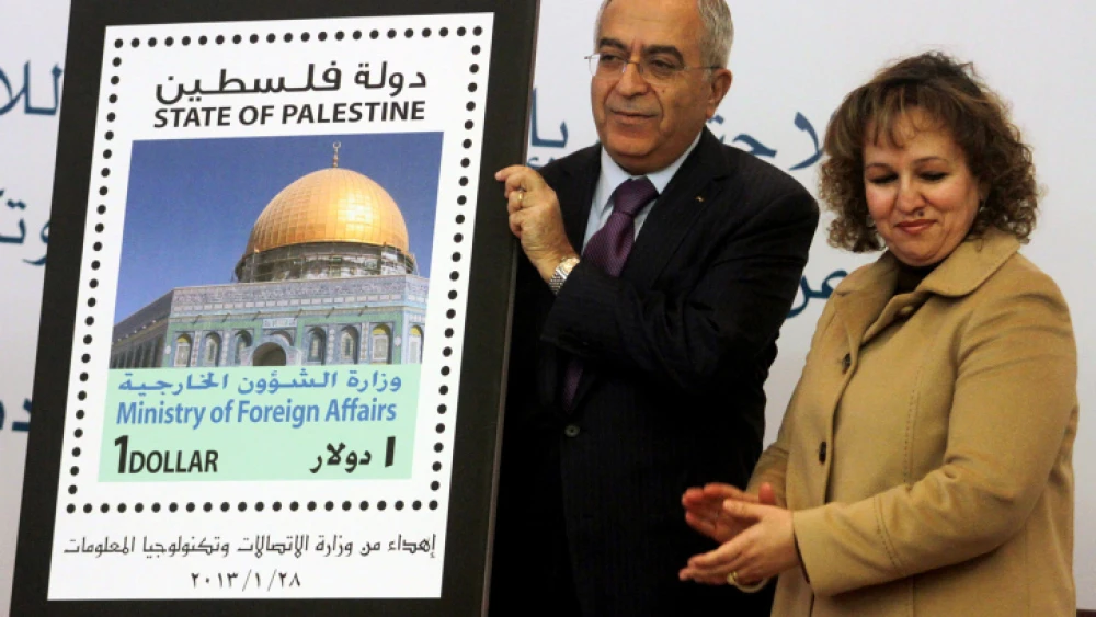 Then-Palestinian Prime Minister Salam Fayyad participates in the unveiling of the first postage stamp bearing the name "State of Palestine," on Jan. 28, 2013. Photo by Issam Rimawi/Flash90.
