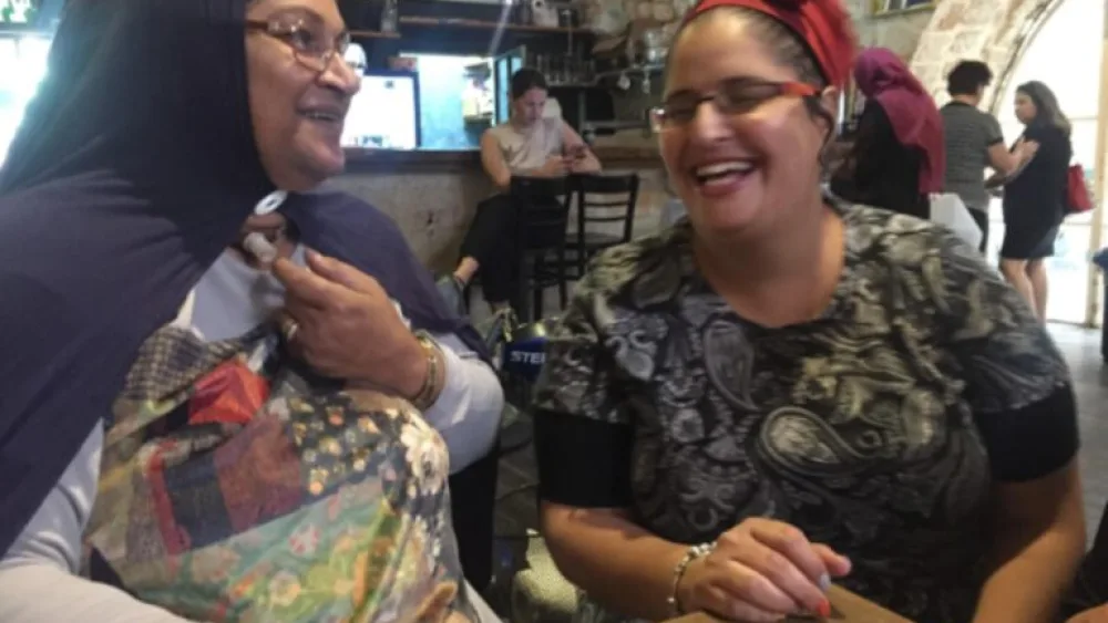Two women at a meeting of the Women’s Vision of Akko Foundation. Photo by Diana Bletter