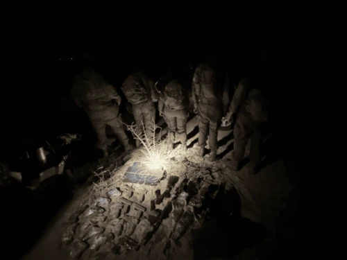IDF troops display some of the arms smuggled by drones across the Egyptian border to Israel earlier this year. Credit: IDF.
