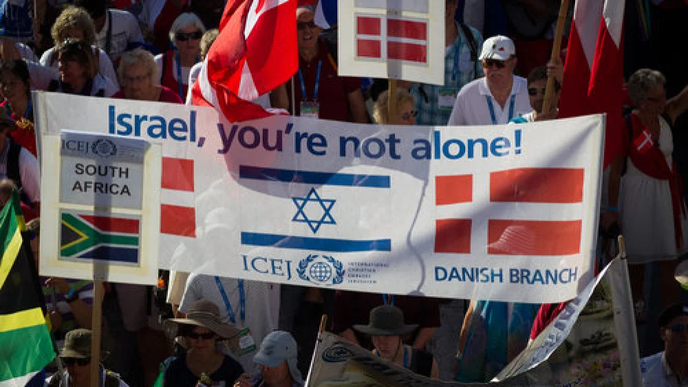 Evangelical Christians wave their national flags alongside the Israeli flag as they march in Jerusalem for International Christian Embassy Jerusalem’s Feast of Tabernacles celebration in October 2016. Credit: Sebi Berens/Flash90.