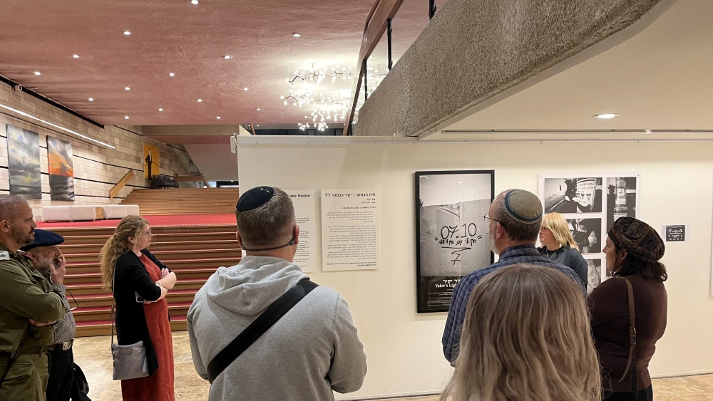 People viewing the "Or's Light" exhibition at the Jerusalem Theatre, April 15, 2026. Photo by Josh Hasten.