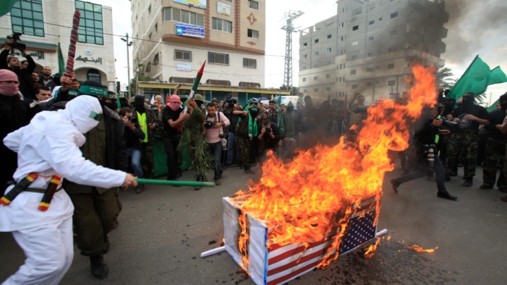 Palestinian Hamas militants set fire to a coffin wrapped with U.S. flag during an anti-Israeli rally in al-Nuseirat refugee camp in the center of the Gaza Strip on Dec. 11, 2009. Photo by Wissam Nassar/Flash90.