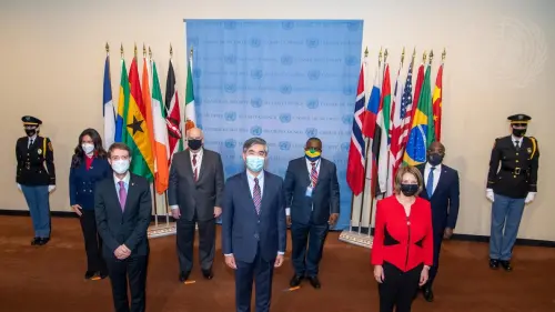 A wide view of an installation ceremony of the national flags of the countries of the newly elected non-permanent members to serve on the U.N. Security Council for the term 2022-23 is held at the United Nations headquarters building in New York City, Jan. 5, 2022. The five new non-permanent members are Albania, Brazil, Gabon, Ghana and the United Arab Emirates. Credit: U.N. Photo/Eskinder Debebe.