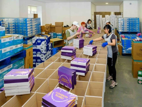 Staff prepare Shavuot packages for Ukrainian Jews in May 2025. Photo credit: FJCU.