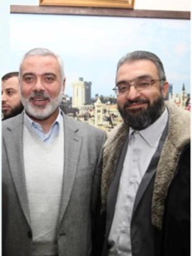 Amin Abu Rashed (right) with Hamas leader Ismail Haniyeh. Source: Facebook.