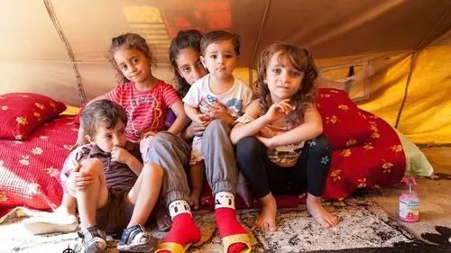 Click photo to download. Caption: Assyrian Christian children who were displaced by the Islamic State terror group are pictured in a tent in Ankawa, Iraq. Credit: Jeff Gardner, Picture Christians Project, picturechristians.org.