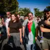 MK Ofer Cassif wears a PLO flag during a protest against the eviction of Arab families from Jewish-owned homes in the eastern Jerusalem neighborhood of Sheikh Jarrah, Sept. 8, 2023. Photo by Chaim Goldberg/Flash90.