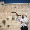A Jewish man blows a shofar at the Western Wall in Jerusalem's Old City, on Aug. 16, 2018. Photo by Yonatan Sindel/Flash90.