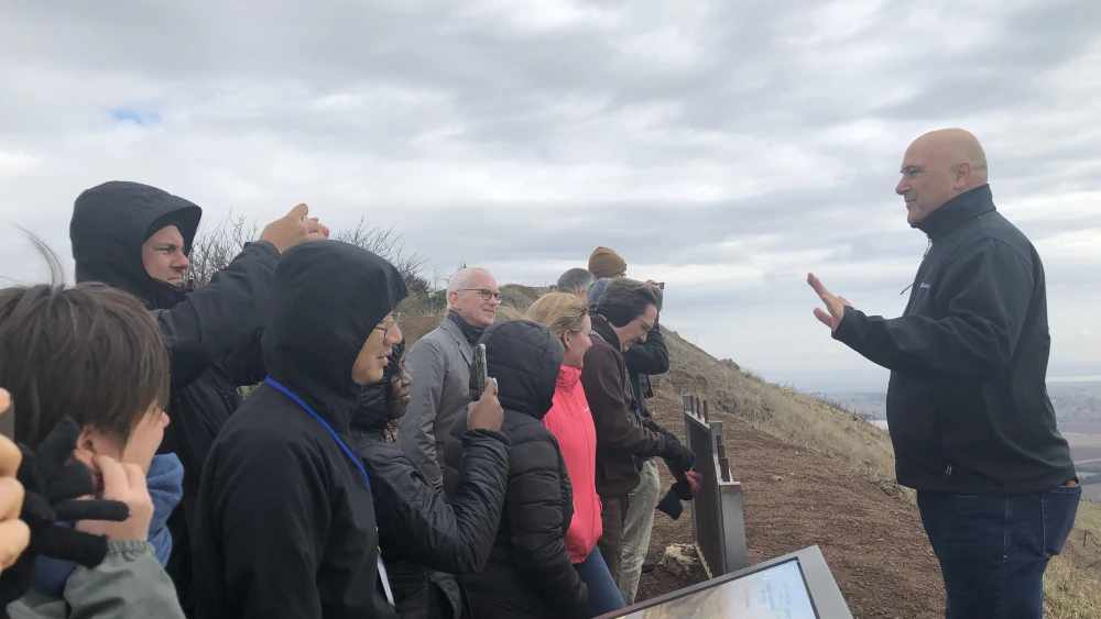 Faculty Fellowship participants meet with Lt. Col. (Res.) Tiran Attia, director of Jewish National Fund-USA affiliate, Special in Uniform, on top of Mount Bental in northern Israel. Photo by Vivian Grossman.