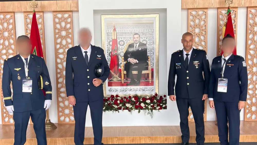 Israeli military attaché to Morocco Col. Sharon Itach, second from right, and members of an Israeli defense and air force delegation pose in front of a portrait of King Mohammed VI at the Marrakech Airshow, Oct. 8, 2026. Credit: IDF.