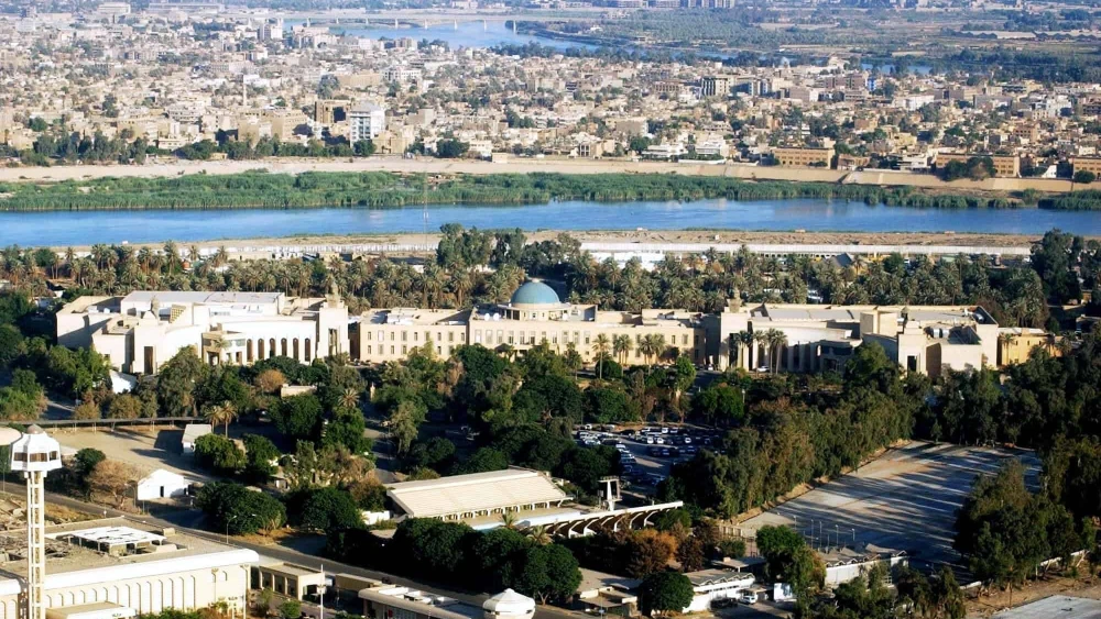 An aerial view of the former Republican Palace, with the Tigris River and the city of Baghdad to the rear, July 21, 2005. Photo by Jim Gordan/USACE HQ via Wikimedia Commons.