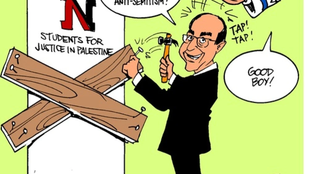 A cartoon posted on the Facebook page of Northeastern University's Students for Justice in Palestine chapter—which was recently suspended for a year—depicts University President Joseph Aoun nailing boards on the door of the student group. Mirroring the conspiracy theory that Israel controls American foreign policy, the cartoon features a disembodied arm from the sky—with a Star of David and “The Lobby” written on its sleeve—patting Aoun on the head. Credit: Northeastern SJP Facebook page.
