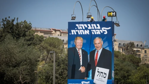 Israeli workers hang a large billboard with pictures of U.S. President Donald Trump and Israeli Prime Minister Benjamin Netanyahu, as part of the Likud election campaign, in Jerusalem on Sept. 4, 2019. Photo by Yonatan Sindel/Flash90.