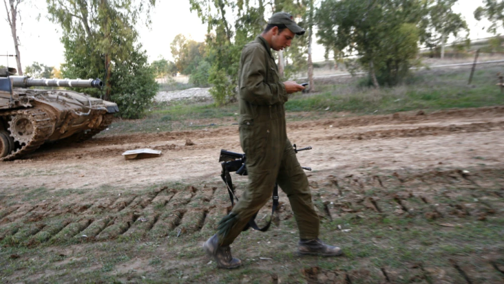 An Israeli soldier makes a phone call during a rest period in Sderot, on Dec. 28, 2008. Photo by Miriam Alster/Flash 90.