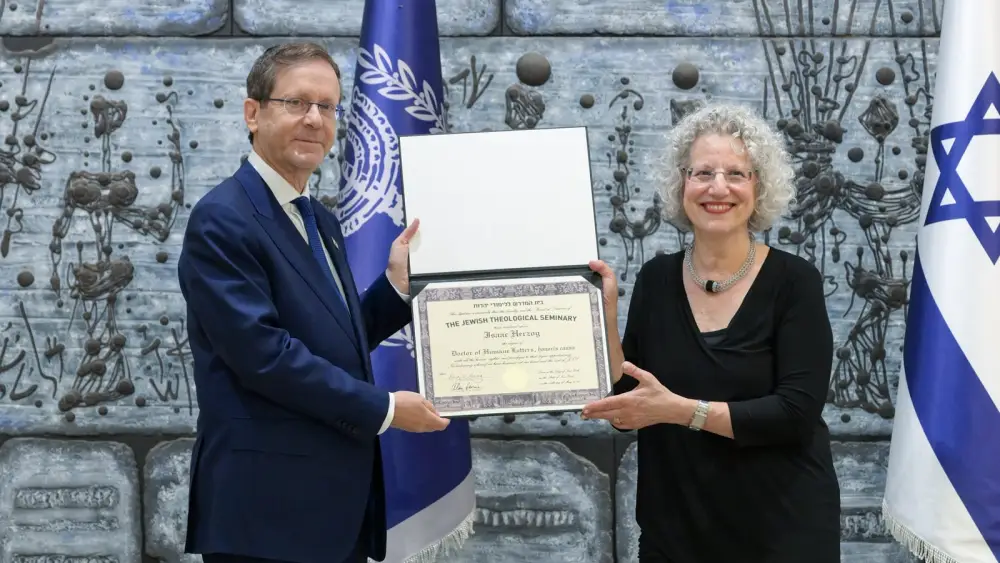 Israeli President Isaac Herzog receives an honorary doctorate from Shuly Rubin Schwartz, chancellor emerita of the Jewish Theological Seminary, at the President's Residence in Jerusalem, Aug. 12, 2026. Photo by Ma'ayan Toaf.